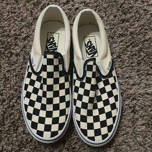 Classic Slip-On Vans black & white checkered sneakers. NEW NEVER WORN.